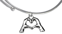 Everyone Is Doing It! Forming Their Fingers And Hands Into The Shape Of A Heart Saying, I Love You" On A Silvertone Adjustable Miracle Wire Bracelet. What A Great Gift For Yourself Or Someone Special. Gift Ready, Comes In A Small Black Velvet Bag.