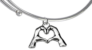 Everyone Is Doing It! Forming Their Fingers And Hands Into The Shape Of A Heart Saying, I Love You" On A Silvertone Adjustable Miracle Wire Bracelet. What A Great Gift For Yourself Or Someone Special. Gift Ready, Comes In A Small Black Velvet Bag.