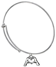 Everyone Is Doing It! Forming Their Fingers And Hands Into The Shape Of A Heart Saying, I Love You" On A Silvertone Adjustable Miracle Wire Bracelet. What A Great Gift For Yourself Or Someone Special. Gift Ready, Comes In A Small Black Velvet Bag.