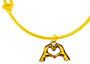 Everyone Is Doing It! Forming Their Fingers And Hands Into The Shape Of A Heart Saying &nbsp;"I Love You" On A 14 KT Goldtone Adjustable Miracle Wire Bracelet. What A Great Gift For Yourself Or Someone Special. Gift Ready Comes In A Small Black Velvet Bag